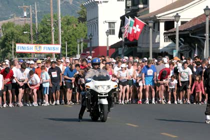 Melania Mahoney Setting their stopwatches and ready to go the runners are lead off by CA Highway Patrolman, Kirk Paulson.